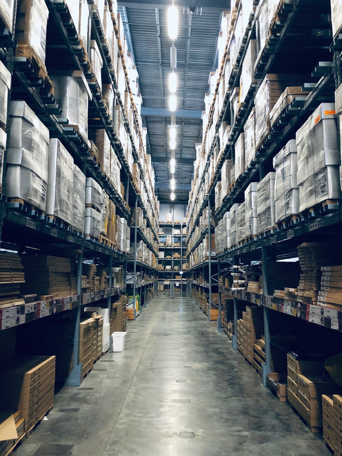 Palletised goods stored in a distribution warehouse ready for transport