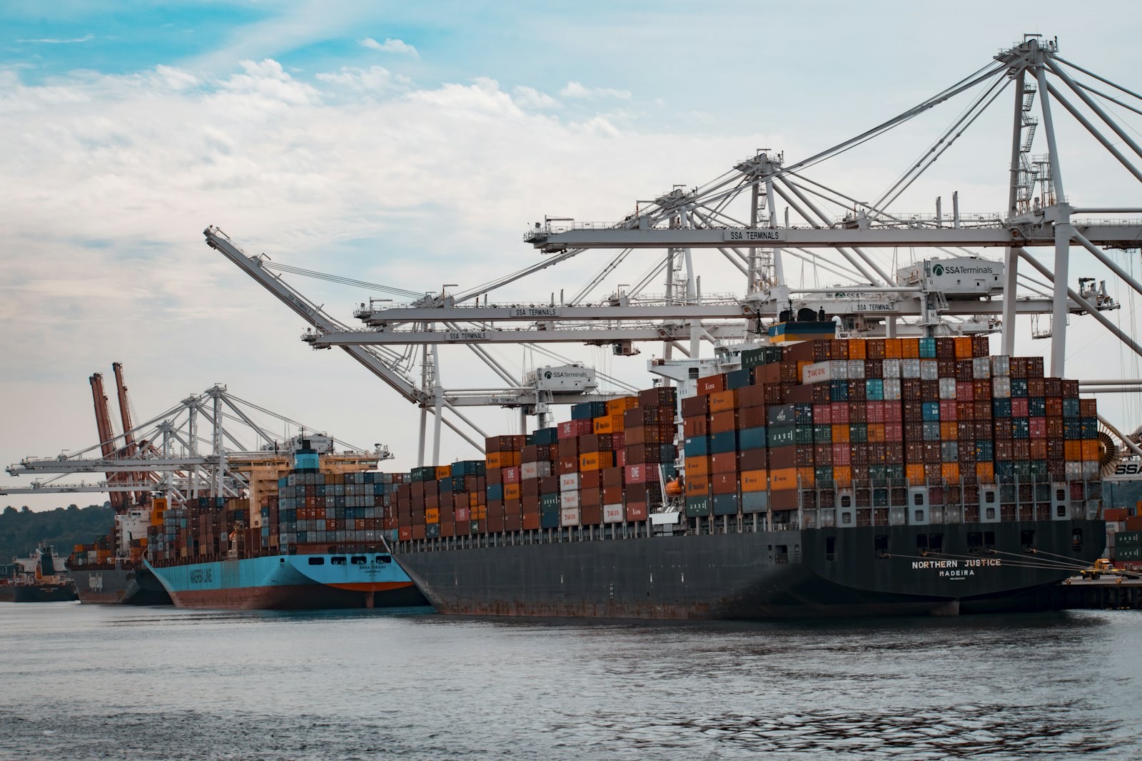Shipping containers stacked at a UK port terminal ready for haulage